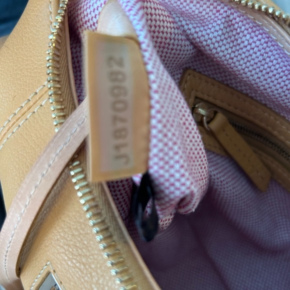 Dooney and Bourke Bag . Medium sized. Has imperfections . - Picture 7 of 17